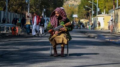A Taliban guard outside a military hospital in Kabul, a day after a deadly attack by ISIS militants. EPA