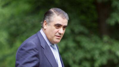 Lorenzo Sanz poses with the Champions League trophy in Versailles. AFP
