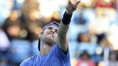 Karen Khachanov serves to Novak Djokovic.