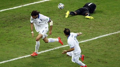 Giorgios Samaras, left, begins to celebrate after his successful penalty to win it 2-1 for Greece in injury time over Ivory Coast on Tuesday at the 2014 World Cup in Fortaleza, Brazil. Mike Blake / Reuters / June 24, 2014