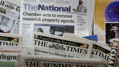 The first edition of The National newspaper sits in the stands in Abu Dhabi. Andrew Parsons / The National