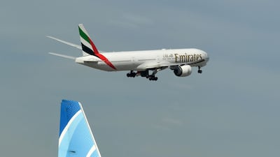 An Emirates aircraft takes off from Dubai International Airport.