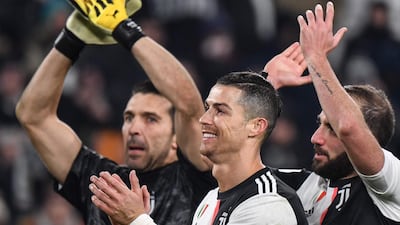 Left to right: Gianluigi Buffon, Cristiano Ronaldo and Gonzalo Higuain after the match. AFP