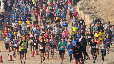 Hundreds of runners participate in the Saqqara Pyramid Race at the site of the Step Pyramid of Djoser in south-west of Cairo, Egypt. AP
