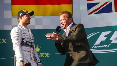 Nico Rosberg of Mercedes-GP talks to actor and former California governor Arnold Schwarzenegger at the podium of the Australian Grand Prix on Sunday. Diego Azubel / EPA