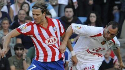 Mallorca's Ivan Ramis (r) tussles with Diego Forlan - now the Spanish defender is set for a move to Upton Park