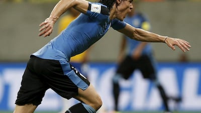 Edinson Cavani of Uruguay celebrates after scoring against Brazil. REUTERS/Paulo Whitaker