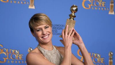 Robin Wright poses with the award for Best Actress in a TV Series, Drama for her role in House of Cards. Reuters