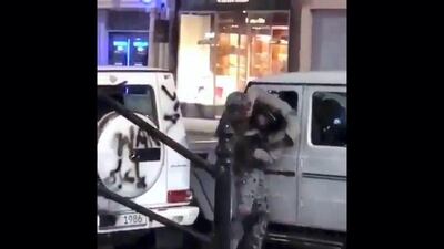 In this video screen grab, Emirati student Abdullah Al Hosani struggles with a man dressed in military fatigues on Brompton Street in London. He challenged the suspect after spotting him spray painting luxury cars in the street.