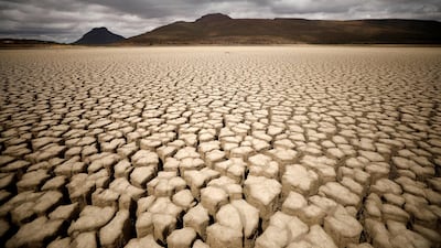 Clouds gather but produce no rain as cracks are seen in the dried up municipal dam in drought-stricken Graaff-Reinet, South Africa. Reuters