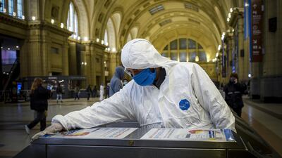 A worker disinfects at Constitucion Train Station during government-ordered coronavirus lockdown in Buenos Aires, Argentina. Getty Images