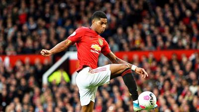 Manchester United's Marcus Rashford scores against Liverpool. EPA