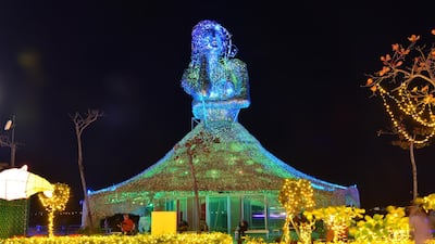 A light-up structure of a women, overlooking the sea . Courtesy Taiwan Tourism