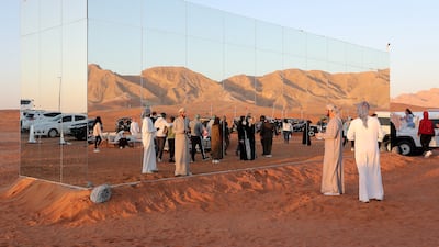 Guests take photos of the mirrored kitchen.