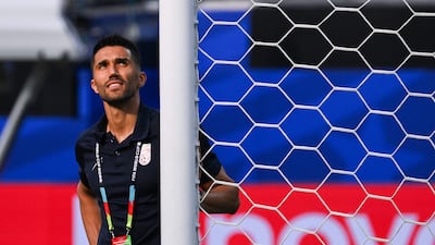 Iran's goalkeeper Hossein Hosseini looks at the goal after the press conference at Los Angeles Stadium in Inglewood on June 14, 2026. AFP
