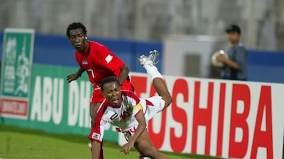 Emirati Ismail Matar fights for the ball with Amadou Coulibaly of Burkina Faso during the 2003 Fifa World Youth Championships in a group game in Abu Dhabi. Karim Jaafar / AFP / December 4, 2003