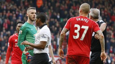 Manchester United's David de Gea and Liverpool's Martin Skrtel get into a confrontation on Sunday at the end of their Premier League match. Phil Noble / Reuters
