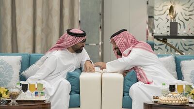 Sheikh Tahnoon bin Zayed, UAE National Security Advisor, left, speaks with Prince Mohammed bin Salman bin Abdulaziz Al Saud, Deputy Crown Prince, second Deputy Prime Minister, and Minister of Defence of Saudi Arabia, right, during a reception hosted by King Salman bin Abdulaziz Al Saud, of Saudi Arabia and Custodian of the Two Holy Mosques (not shown), during an official visit to Saudi Arabia. Mohamed Al Hammadi / Crown Prince Court - Abu Dhabi