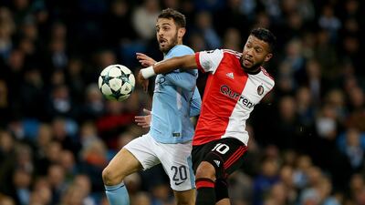 Manchester City's Bernado Silva (L) challenges Feyenoord's Tonny Vilhena during the UEFA Champions League group F soccer match between Manchester City and Feyenoord at the Etihad Stadium in Manchester, 21 November 2017. EPA/Nigel Roddis