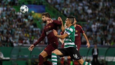 Sporting’s Rodrigo Battaglia challenges Barcelona’s Gerard Pique. Rafael Marchante / Reuters