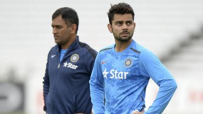 MS Dhoni, left, and Virat Kohli will shoulder heavy expectations in leading India into the 2015 Cricket World Cup, beginning with their pressure-cooker of an opening match on Sunday against Pakistan. Philip Brown / Reuters