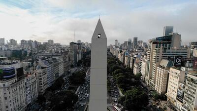 A man looks down from the observation deck of the 68-metre Obelisk in Buenos Aires, Argentina. AFP