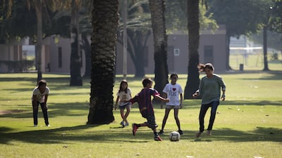 A group of youth spend National Day playing football at Safa Park in Dubai, December 2, 2013. Sarah Dea / The National