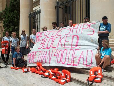 Members of Lifeline's crew stage a protest outside the tribunal. Roger Azzopardi/ AP Photo
