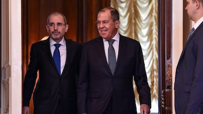 Russian Foreign Minister Sergei Lavrov (C) and his Jordanian counterpart Ayman Safadi enter a hall during a meeting in Moscow on July 4, 2018. AFP