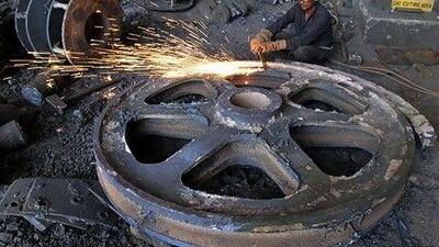 An Indian welder at work in a factory in Ahmedabad. Manufacturing production in India last month expanded at the slowest pace this year. Ajit Solanki / AP Photo