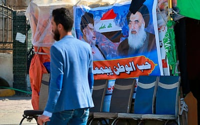 A poster of Shiite spiritual leader Grand Ayatollah Ali Al Sistani that reads "the love of the country bonds us together," is seen in Najaf, Iraq. AP