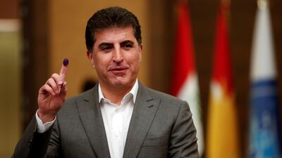 Nechirvan Barzani shows his ink-stained finger after voting in Erbil. Reuters