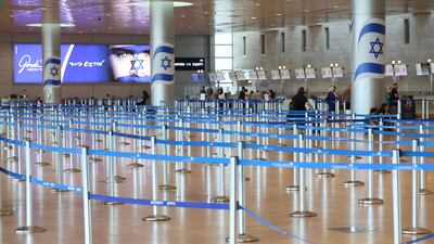 An empty waiting area at Ben Gurion International Airport. Israel's largest labour union, Histadrut, called for a nationwide general strike yesterday urged Israeli Prime Minister to reach a deal to free the remaining hostages held by Hamas. EPA