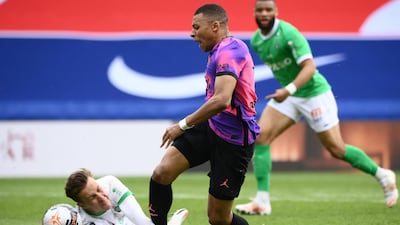 PSG attacker Kylian Mbappe is fouled by Saint-Etienne goalkeeper Etienne Green to earn a penalty. AFP