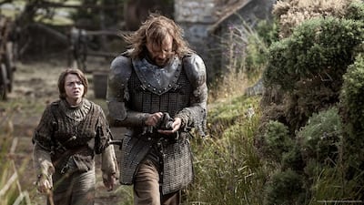 Maisie Williams, left, as Arya Stark and Rory McCann as "the Hound" in Game of Thrones, Season 4. Courtesy HBO