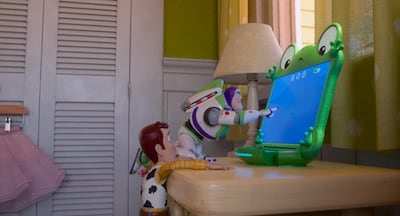 Woody (voiced by Tom Hanks), Buzz Lightyear (Tim Allen) and Lilypad (Greta Lee) in Toy Story 5. Photo: Disney / Pixar