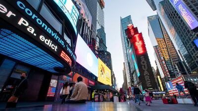 News related to coronavirus is seen on a display at Times Square in New York City, New York. Reuters