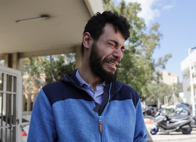 Abdelrahman Mohammed, 24, a Syrian living in Beirut, weep outside Rafik Hariri University Hospital in Beirut, Lebanon, a day after an Israeli strike on April 8 killed five members of his family. Reuters