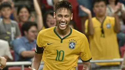 Neymar shown celebrating a fourth goal as he captained Brazil to a friendly win over Japan in Singapore last October. Roslan Rahman / AFP / October 14, 2014