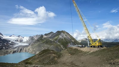 A crane works at the construction site of the highest wind park in Europe. Olivier Maire / EPA