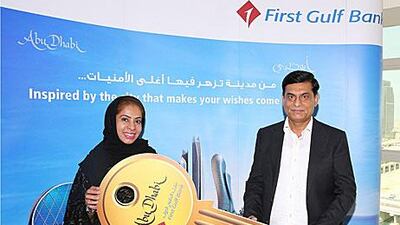 Haresh Kumar received the keys to a luxury two-bedroom sea-view apartment in Ocean Terrace on the capital's Al Reem Island.