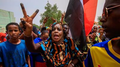 A Sudanese protesters flashes the V-sign during a mass demonstration against Sudan's ruling generals in Khartoum on June 30, 2019. AFP