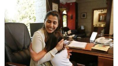 Jordanian parliament candidate Hind Al Fayez talks to her daughter Jawaher as she came to her mother's in-home office in Amman, Jordan.