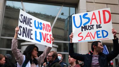 Protesters against the Trump administration's actions gather outside USAID headquarters in Washington on Monday. AFP