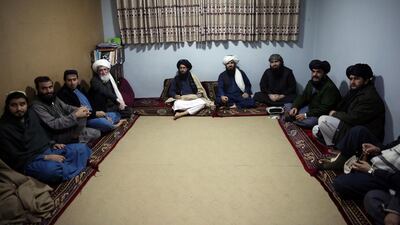 FILE - In this Dec. 14, 2019 file photo, jailed Taliban sit inside the Pul-e-Charkhi Jail after speaking with The Associated Press, in Kabul, Afghanistan. A three-member Taliban technical team arrived Tuesday, March 31, 2020, in the Afghan capital to oversee the release of their prisoners as part of a peace deal signed by the Taliban and the U.S., a spokesman for the insurgent group said. (AP Photo/Rahmat Gul, File)