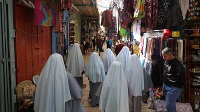 Nuns attend the Good Friday procession in the Old City of Jerusalem. EPA