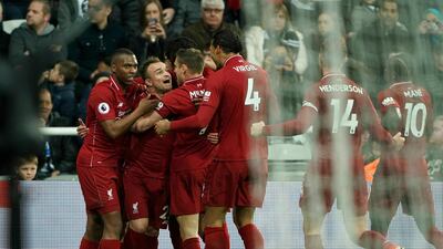 Divock Origi scored Liverpool's third goal against Newcastle United during the Premier League match at St James' Park. PA/AP