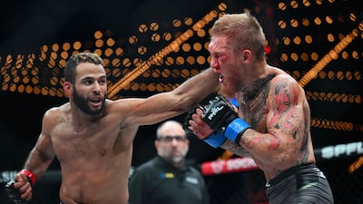 Saudi fighter Abdullah Al Qahtani, left, and American David Zelner compete during the Professional Fighters League 2023 playoffs featherweight fight in New York. AFP