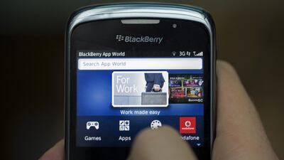 The BlackBerry App World logo is seen on the screen of a BlackBerry Curve smartphone, produced by BlackBerry Ltd., in this arranged photograph taken in London, U.K., on Monday, Sept. 23, 2013. BlackBerry said yesterday it reached a tentative agreement for a $4.7 billion buyout by a group led by Fairfax Financial Holdings Ltd., its biggest shareholder. Photographer: Simon Dawson/Bloomberg