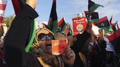 A protester holds up a card with the words “No extension” on it during a demonstration against the General National Congress in the Libyan city of Benghazi on February 14, 2014. Esam Omran Al Fetori / Reuters